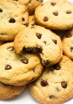 chocolate chip cookies are piled on top of each other