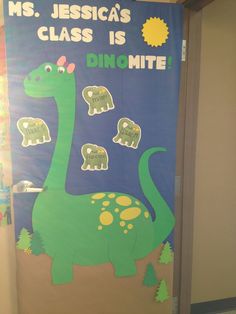 a door decorated with an image of a dinosaur and some other animals that say ms jesus's class is dinomite