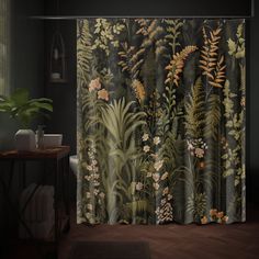 a bathroom with a shower curtain that has plants on it