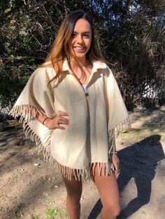 "Poncho top,Wool Poncho, Tan,Indian poncho,Ethnic,Indian Poncho,Mexican Poncho,small,medium,fringed,collar Nice Warm Poncho with fringe and wood buttons up the front Measures: across 38\" Length 26\" It seems that is would fit small-medium Good condition Looks to be 100% wool BL812 Poncho top,Wool Poncho, Tan,Indian poncho,Ethnic,Indian Poncho,Mexican Poncho,small,medium,fringed,collar" Beige Fringed Poncho Shawl, Beige Fringe Shawl Poncho, Oversized Fringe Cape Poncho, Oversized Fringe Casual Poncho, Oversized Fringe Poncho Casual Style, Casual One Size Poncho With Fringe, Casual One-size Poncho With Fringe, Bohemian Cream Poncho With Fringe, Cream Bohemian Poncho For Fall