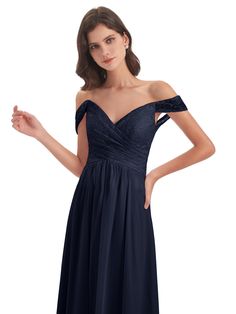 a woman in a blue dress posing with her hand on her hip and wearing an off shoulder