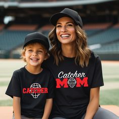 Custom Catcher Mom Tee.  You can personalize with your choice of colors and includes a name/number on the back.   Coordinating Kids Tee here: https://ourwildflowers.etsy.com/listing/1571735831 * Optional: Swap for glitter!  Please visit this link to see glitter options and add to your cart: https://www.etsy.com/listing/994799246/additional-order-add-ons?ga_search_query=add%2Bons&ref=shop_items_search_1&frs=1 D E T A I L S *  Tee is 100% Cotton by Bella + Canvas * The tees are unisex, please refe Customizable Black Fan Apparel Tops, Black Tops With Name Print For Baseball Season, Customizable Short Sleeve Sports Fan Tops, Customizable Short Sleeve Tops For Sports Fans, Customizable Cotton Tops For Sports Fans, Customizable Crew Neck Tops For Sports, Customizable Crew Neck Tops For Sports Events, Customizable Sporty Crew Neck Tops, Customizable Sporty Tops For Fan Merchandise