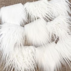 the white fur is laid out on the floor