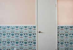 an open door in a room with wallpaper