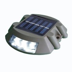 a solar powered light on a white background