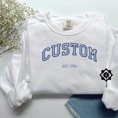 Personalized Custom Embroidered Handmade Sweatshirt, Embroidered Crewneck and Comfort Colors Sweatshirts, Gift for Her, Gift for Him, Wedding and Engagement Gifts Top Chest Center Design: This text will be placed in the top chest area and will measure 8 inches across. Left Chest Design: This text will be placed in the left chest area and will measure 4 inches across. Text Size: Remember, the more text you include, the smaller it will appear in both designs. It's best to keep it short, like a sin Classic White Sweatshirt For College, White Fitted Cotton Sweatshirt, Customizable White Top With Custom Embroidery, White Custom Embroidered Top For College, White College Sweatshirt With Machine Embroidery, White Machine Embroidery Sweatshirt For College, Custom Embroidered Sweatshirt, Chest Design, Longing Quotes