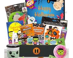 a halloween gift box filled with candy, treats and other things to make it look like someones happy halloween