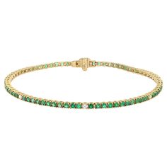 This beautifully crafted tennis bracelet features round cut green Emeralds and diamonds encrusted in four prong setting. Crafted in 14k yellow gold. Total diamond weight: 0.09 carat. Diamond Quality: G-H color and VS-SI clarity. Total emerald weight: 1.98 carats. Length: 7 inches. Width: 2.3 mm. Total weight: 6.61 gms. Bracelet closes securely with a box clasp. This tennis bracelet is a timeless piece that holds a place in the collection of every jewelry lover. Comes with a presentable gift box and appraisal. Luxury Green Women's Tennis Bracelet, Diamond Tennis Bracelet, Tennis Bracelet Diamond, Green Emerald, Emerald Diamond, Tennis Bracelet, Jewelry Lover, Delicate Bracelet, Timeless Pieces