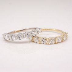 two gold and white diamond wedding rings