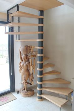 a wooden spiral staircase in a home