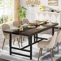 a dining room table set with chairs and plates on the placemat in front of it