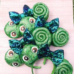 green and blue sequinized hair bows with googly eyes