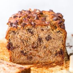 a loaf of chocolate chip banana bread on a cutting board