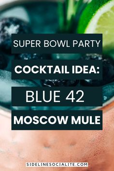 a cocktail in a copper cup with limes and blueberries on the rim text reads super bowl party cocktail idea blue 42 moscow mule