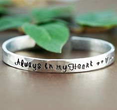 "Take a LOOK at our Website: ANNIEREH.com Memorial Bracelet, Always in my Heart Bracelet, Personalized Silver Cuff Bracelet, Hand Stamped Bracelets, Memorial Jewelry Customize our cuff bracelets with your favorite word/s, meaningful phrase, special saying, names of loved ones, grandchildren, dates and even coordinates for the place you met your partner or shared a special moment with someone. PRICE SHOWN IS for our ALUMINUM, BRASS & COPPER Available Metal Choices are: Aluminum(silver), Brass Inspirational Heart-shaped Adjustable Bracelets, Silver Inspirational Bracelets For Valentine's Day, Inspirational Silver Bracelets For Valentine's Day, Inspirational Personalized Heart-shaped Bracelets, Hand Stamped Metal Bracelets As Gift, Personalized Silver Cuff Bracelet, Stamped Bracelets, Custom Bangle, Remembrance Jewelry