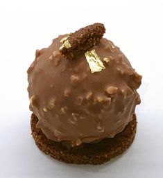 a close up of a chocolate dessert on a white surface