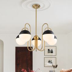 a chandelier hanging over a dining room table