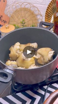 a pan filled with food sitting on top of a stove