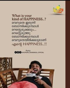 a man laying on top of a wooden chair next to a sign that says what is your kind of happiness?