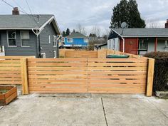 a wooden fence in front of some houses