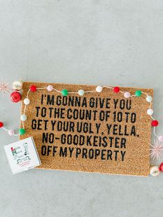 a door mat that says i'm going give you to the court of to get your ugly yella no - gookiester off my property