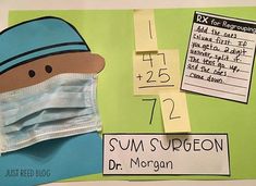 a paper cut out of a person wearing a surgical mask with sticky notes attached to it