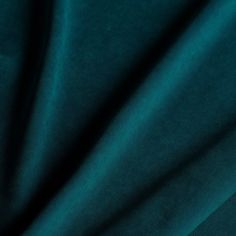 a close up shot of the fabric in teal green color, it is very soft