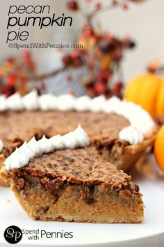 a slice of pumpkin pie on a plate with some oranges in the back ground