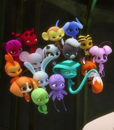 a bunch of littlest pet toys hanging from the ceiling