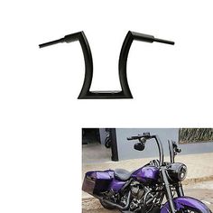 a purple motorcycle parked on the side of a road next to a black handlebar