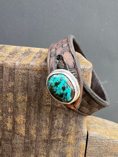 Natural Sierra Nevada Turquoise,  Sterling  Silver Button, Hand Stamped Leather Bracelet  size 7 1/4" All leather bands can be traded out for a different size. Otteson turquoise, Tonopah, Neveda Adjustable Turquoise Leather Bracelet In Rustic Style, Adjustable Rustic Turquoise Leather Bracelet, Adjustable Hand Tooled Western Leather Bracelet, Handmade Turquoise Leather Bracelet, Handmade Leather Bracelet In Turquoise, Handmade Leather Turquoise Bracelets, Adjustable Turquoise Leather Bracelet Southwestern Style, Adjustable Turquoise Bracelet With Patina, Adjustable Turquoise Leather Bracelet In Southwestern Style