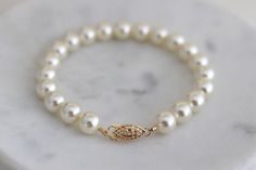 This classic timeless bracelet is the perfect accessory for any occasion.  Whether you are walking down the aisle or attending a special event this is a must have! Pearls never go out of style. It is hand beaded with Austrian crystallized pearls and finish off with a filigree fish hook clasp.  Clasp is sterling 14Kt gold filled. Available in silver in sterling silver. You can make this bracelet a dainty style by choosing 3-4mm pearls or bold with 8mm pearls.  Choose yours at checkout. Bracelet measures about 7 1/2" long but length can be customized.  Please leave your wrist measure at checkout.  A 7 1/2" bracelet will comfortably fit up to a 6 3/4" wrist leaving some room for movement. If you need a longer length please let me know. Pearls are available in different colors and sizes. Elegant Pearl Bracelet With Pearl Drop For Anniversary, Classic White Bracelets For Wedding, Classic Gold Pearl Drop Bracelet, Classic White Wedding Bracelets, Elegant Pearl Charm Bracelet For Bridesmaid, Elegant Beaded Bracelets For Anniversary, Elegant Pearl Bracelets For Anniversary, Elegant Pearl Drop Bracelets For Bridesmaids, Elegant Pearl White Bracelets For Bridesmaid Gift