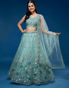 💠👗💙 Steal the show in this turquoise blue net Lehenga Choli! Embrace a stunning and captivating look! 😍💃 #ArabicAttire #TurquoiseTemptation #LehengaLove #Fashionista #ChicAndStylish #GlamorousVibes #DressToImpress 👑🌟🛍️ Turquoise Lehenga, Blue Net Lehenga, Gold Lengha, Plus Size Lehenga, Net Lehenga Choli, Heavy Lehenga, Modest Evening Dress, Party Wear Lehenga Choli, Work Lehenga