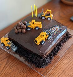 Chocolate cake, chocolate icing, cake "dirt", Whoppers "boulders" and construction vehicles on cake Construction Site Cake, Mum Life, 3rd Birthday Cakes