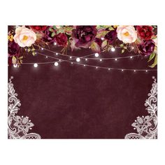 an old fashioned photo frame with flowers and string lights