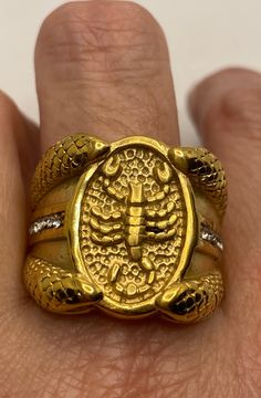 Vintage Scorpio scorpion ring with snakes size 10 Fine details worked into the stainless steel casting. plated with Asian 22k yellow gold accents and clear crystals Steel rings can not be re sized. All jewelry is shipped in a nice gift box. Check out our over a THOUSAND great reviews Engraving is $4 per letter and is not always perfect depending on the piece. It can take a few days if the jeweler is busy. This is payable to Paypal Judithsltd@gmail.com Gold Scorpion, Scorpion Ring, Stainless Steel Ring, Clear Crystals, Size 10 Rings, Stainless Steel Rings, Steel Ring, Vintage Yellow, Gold Style