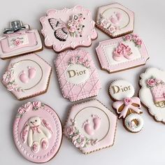 decorated cookies with pink and white designs on them