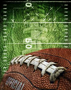 an image of a football on the field with green grass and white lines in the background