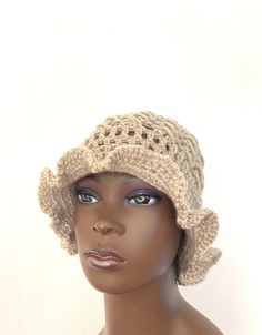 FREE WORLDWIDE SHIPPING ON ALL ITEMS For a limited time only. Welcome to my shop, all items handmade by me with passion READY TO SHIP I hand crocheted this lovely wavy cloche hat in the finest, softest oatmeal high quality woolblend yarn. One size fits all. Middle section is a beautiful lace effect pattern. Suitable for summer or winter wear. Guaranteed to add style to any wardrobe:) All items come with a gift tag and ribbon attached ready to be given as a gift. ❤️Shipping times: This item is re Bohemian Bucket Hat For Spring, Bohemian Spring Bucket Hat, Bohemian Crochet Hat With Short Brim For Festival, Bohemian Crochet Festival Hat With Short Brim, Beige Crochet Hat For The Beach, Bohemian Bucket Hat With Curved Brim, Bohemian Slouchy Knitted Hat, Hippie Crochet Hat For Beach, One Size, Bohemian Beige Crochet Hat For Winter