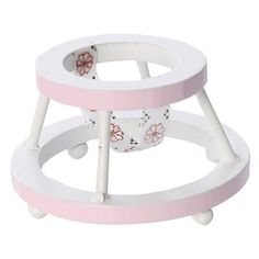 two white and pink baby stools with flowers on the bottom, one sitting on wheels