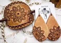 a pair of wooden earrings sitting on top of a table