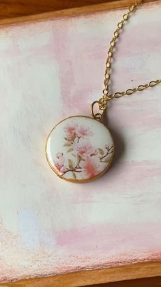 Beautiful #cherryblossom #necklace for #mimi on #mothersday Dainty Locket Necklace With Adjustable Chain For Wedding, Dainty Wedding Locket Necklace With Adjustable Chain, Delicate Round Pink Necklace, Rose Gold Jewelry With Pressed Flowers For Wedding, Pink Rose Design Pendant Necklace, Delicate Pink Necklace With Rose Design, Feminine Flower Necklaces For Wedding, Birth Flower Necklaces For Weddings, Pink Round Pendant Necklace For Wedding