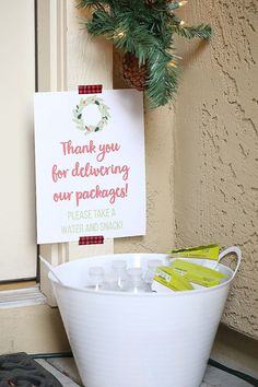 a bucket filled with personal care items sitting next to a sign that says thank you for delivering our packages