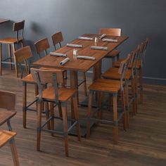 a dining room with wooden chairs and tables