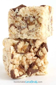 two pieces of chocolate chip rice krispy treats stacked on top of each other in front of a white background