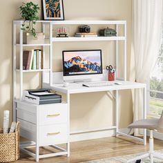 a desk with a computer on top of it in front of a window and bookshelf