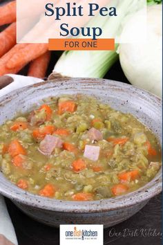 a bowl of split pea soup with carrots and celery on the side