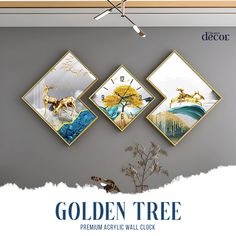 the golden tree wall clock is on display in front of a gray wall with four pictures