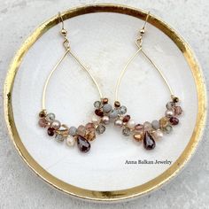 Anna always keeps you impressed and guessing with her creativity and edge! Our classic Anna earrings refreshed featured the movement of sculptural gemstones in a rainbow of colors atop the timeless hoop. Enjoy her everyday, for special occasions and everything in between! Length: 2″Featuring Garnet, Topaz, Smoky Topaz and Pearls. Elegant Multi-stone Hoop Earrings, Elegant Multi-stone Hoop Jewelry, Elegant Multicolor Jewelry For Everyday, Elegant Multicolor Everyday Jewelry, Elegant Multicolor Hoop Jewelry, Elegant Multicolor Dangle Hoop Earrings, Elegant Multicolor Gemstone Hoop Earrings, Elegant Multicolor Teardrop Hoop Earrings, Chocolate Jewelry