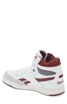 This street-ready mid-top sneaker has a basketball-inspired silhouette with a leather upper sporting suede details and an off-the-hardwood feel. Lace-up style Cushioned footbed Leather upper/synthetic lining/rubber sole Imported Throwback High-top Basketball Shoes With Boost Midsole, Throwback High-top Basketball Shoes For Light Sports, Throwback High-top Basketball Shoes With Cushioned Footbed, Throwback Mid-top Basketball Shoes With Boost Midsole, Throwback High-top Basketball Sneakers, White High-top Throwback Sneakers, Throwback White High-top Sneakers, White Throwback High-top Sneakers, Throwback High-top Sneakers With Boost Midsole